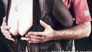 Older woman and partner on a leather couch in studio light